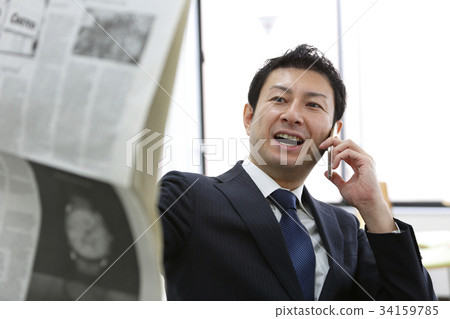 Middle businessman working in the office Middle businessman working in the office 34159785