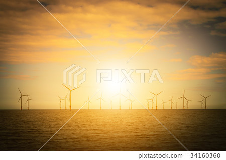 Sunset Offshore Wind Turbine in a Wind farm 34160360