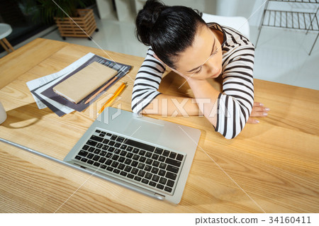 Top view of a hard working tired woman being Top view of a hard working tired woman being 34160411