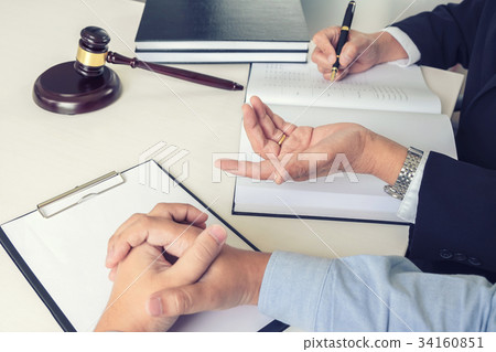 Close up of gavel, Male lawyer or judge Consult with client and 34160851
