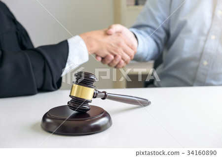 Image of hands, Male lawyer or judge and client shaking hands on Image of hands, Male lawyer or judge and client shaking hands on 34160890