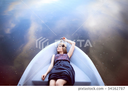 beautiful girl laying on the boat 34162787