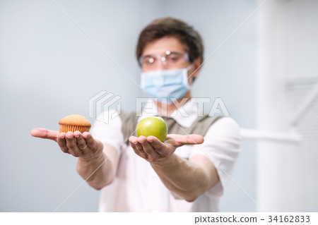 Doctor dentist man speaks about healthy nutrition Doctor dentist man speaks about healthy nutrition 34162833