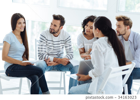 Smart professional psychologist holding a laptop 34163023