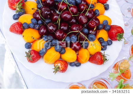 Plait with strawberry, blueberry, sweet cherry Plait with strawberry, blueberry, sweet cherry 34163251