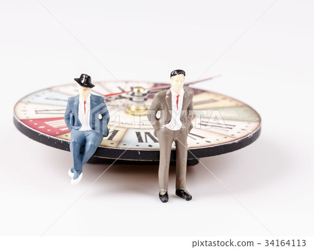 model of man sitting on beautiful old clock 34164113
