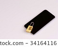 cell phone security - lock and phone on white 34164116