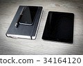 calendar or diary with pen, smarthphone and 34164120