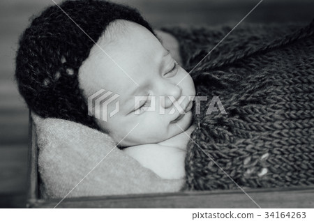 newborn sleeping baby boy with knitted hat newborn sleeping baby boy with knitted hat 34164263