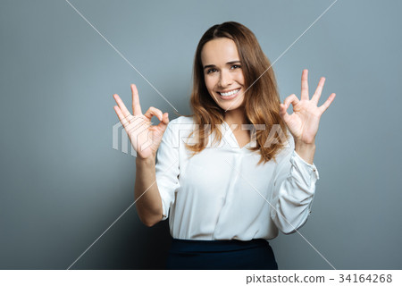 Joyful happy woman feeling optimistic Joyful happy woman feeling optimistic 34164268