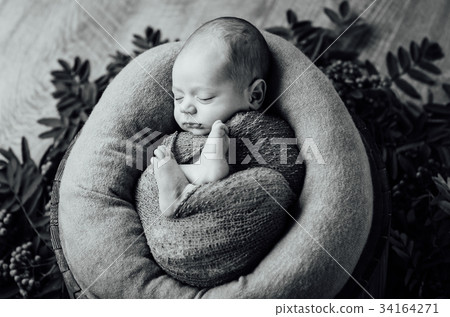 newborn sleeping baby boy with knitted hat newborn sleeping baby boy with knitted hat 34164271
