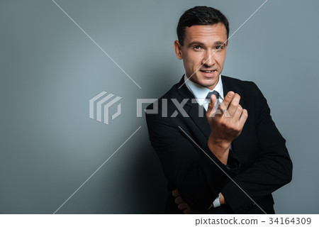 Thoughtful confident businessman talking to you 34164309