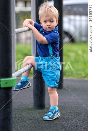 Toddler boy at playground  34165783