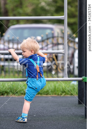 Toddler boy at playground  34165784