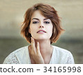 Beautiful young girl smiling 34165998