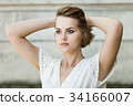 Beautiful girl in white summer dress 34166007