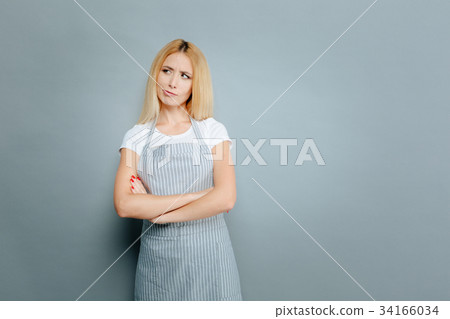 Joyful female person making faces Joyful female person making faces 34166034