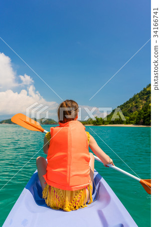 Rear view of young woman experiencing freedom 34166741