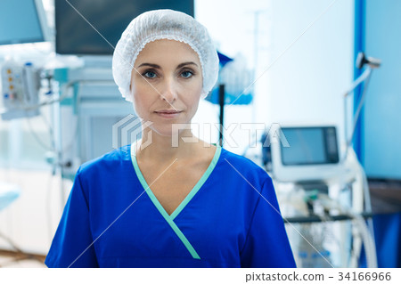 Serious nurse looking straight at camera 34166966