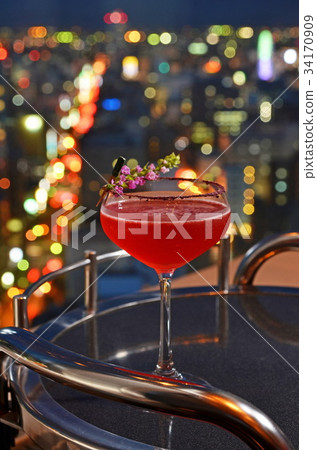 Cocktail glasses with city view 34170909