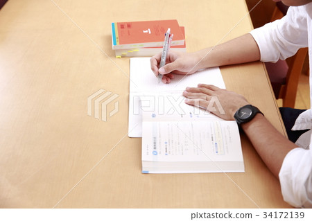 Male student studying for the exam Male student studying for the exam 34172139