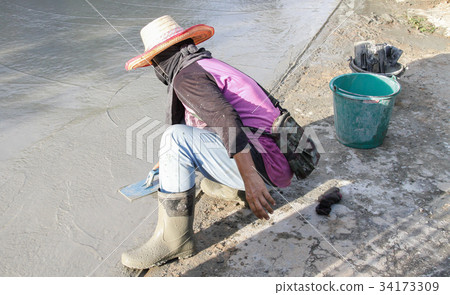 Pouring cement in the alley 34173309