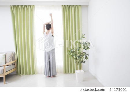 A woman by the window 34175001