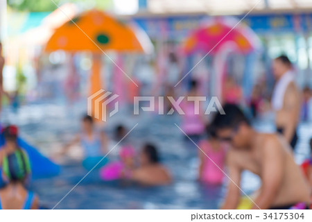 Blurred of Child having fun in swimming pool 34175304