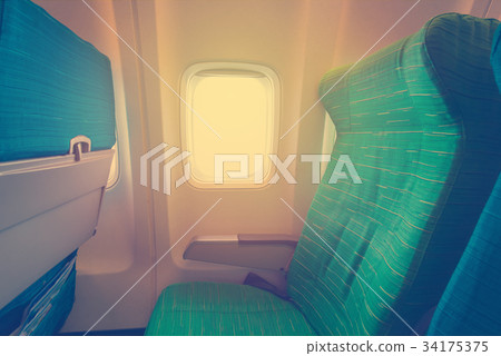 Airplane seat with in cabin of huge aircraft Airplane seat with in cabin of huge aircraft 34175375