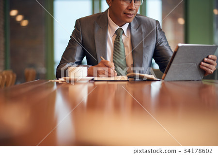 Businessman taking notes Businessman taking notes 34178602
