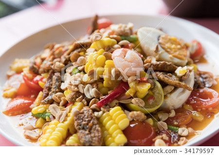 Closeup Thai local street food spicy fruits salad Closeup Thai local street food spicy fruits salad 34179597