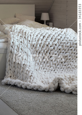 White scandinavian interior with knit plaid. White scandinavian interior with knit plaid. 34183353