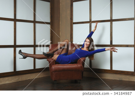 Happy girl in dress with hands up Happy girl in dress with hands up 34184987