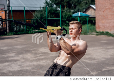 Male athlete close-up, trains nature the city Male athlete close-up, trains nature the city 34185141