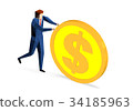 Businessman rolling a huge dollar coin 34185963