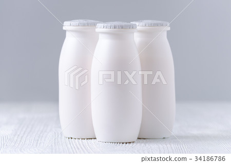 drink yogurt in plastic bottles on gray background drink yogurt in plastic bottles on gray background 34186786