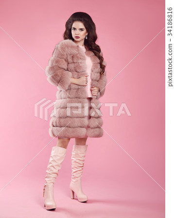 Fashion woman look. Brunette lady in fur coat and Fashion woman look. Brunette lady in fur coat and 34186816