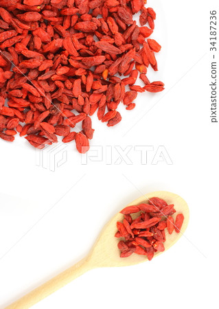 dried goji berries on a wooden spoon 34187236