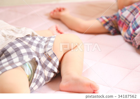 Brother and sister taking a nap Brother and sister taking a nap 34187562