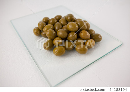 Close up of olives in martini glass Close up of olives in martini glass 34188194