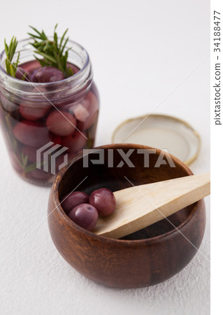 Close up of green olives on glass Close up of green olives on glass 34188477