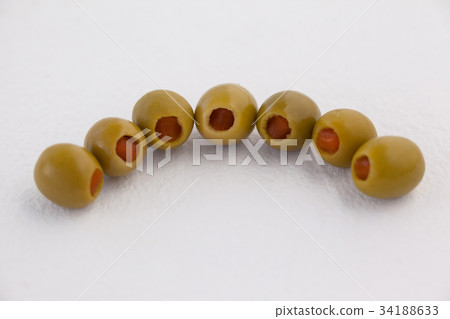 High angle view of olives in vodka martini High angle view of olives in vodka martini 34188633