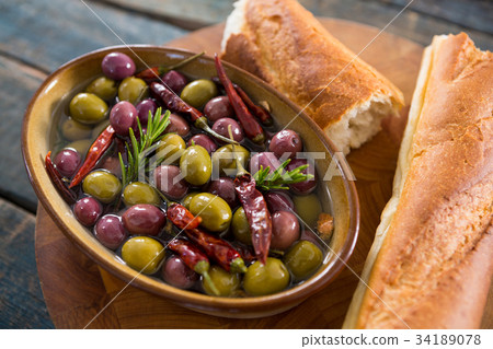 Dry olives in white bowl Dry olives in white bowl 34189078
