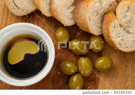 Cropped image of olives with thyme served in glass bowl 34189105