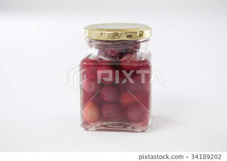 Close-up of marinated olives with glass of wine Close-up of marinated olives with glass of wine 34189202