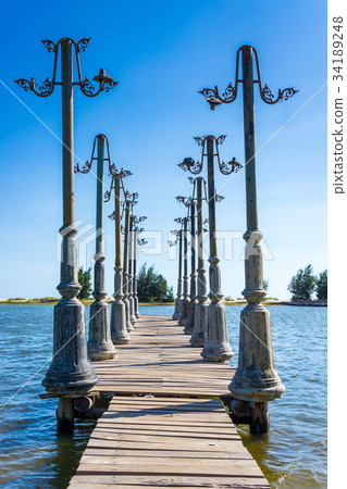 The wood pier and light posts decoration The wood pier and light posts decoration 34189248