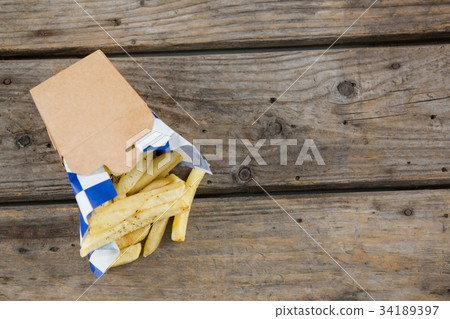 High angle view of burger and French fries in box 34189397
