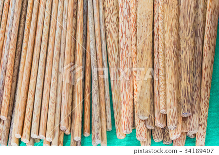 Bamboo chopsticks isolated on green 34189407