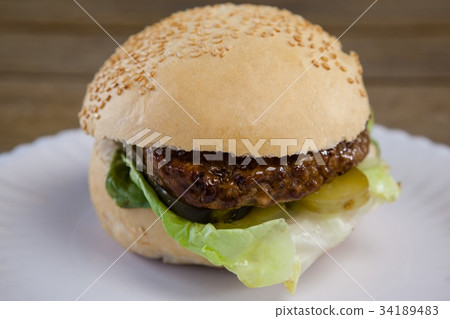 Hamburger, french fries and cold drink on table Hamburger, french fries and cold drink on table 34189483