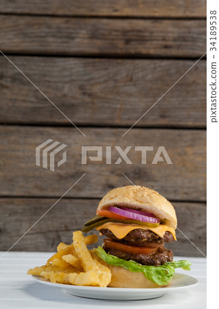 Hamburger, french fries and cold drink on table 34189538